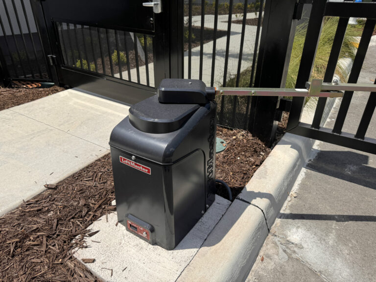 Automatic gate opener system for commercial fencing.